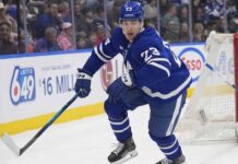 Toronto Maple Leafs forward Matthew Knies looking focused on the ice during an NHL game.