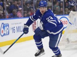 Toronto Maple Leafs forward Matthew Knies looking focused on the ice during an NHL game.