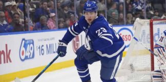 Toronto Maple Leafs forward Matthew Knies looking focused on the ice during an NHL game.