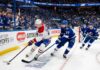Montreal Canadiens forward Juraj Slafkovsky (#20) carrying the puck against Tampa Bay Lightning defenseman Victor Hedman (#77) during Game 2 of the 2026 NHL Playoffs.