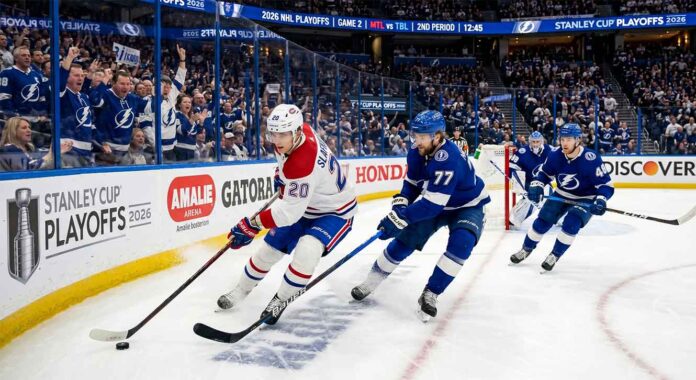 Montreal Canadiens forward Juraj Slafkovsky (#20) carrying the puck against Tampa Bay Lightning defenseman Victor Hedman (#77) during Game 2 of the 2026 NHL Playoffs.