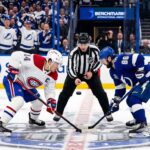 Nick Suzuki of the Montreal Canadiens faces off against Nikita Kucherov of the Tampa Bay Lightning in Game 1 of the 2026 NHL Playoffs.