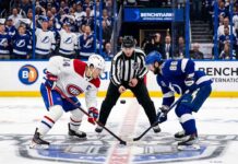 Nick Suzuki of the Montreal Canadiens faces off against Nikita Kucherov of the Tampa Bay Lightning in Game 1 of the 2026 NHL Playoffs.