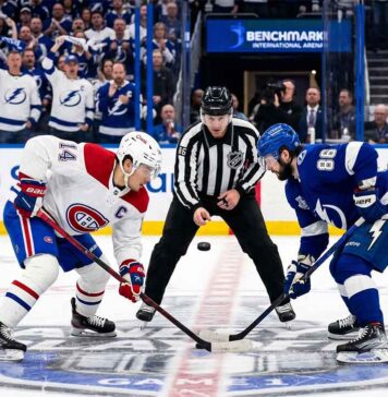 Nick Suzuki of the Montreal Canadiens faces off against Nikita Kucherov of the Tampa Bay Lightning in Game 1 of the 2026 NHL Playoffs.