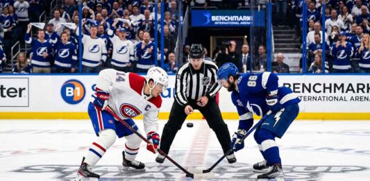Nick Suzuki of the Montreal Canadiens faces off against Nikita Kucherov of the Tampa Bay Lightning in Game 1 of the 2026 NHL Playoffs.