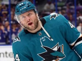 A photo-edit showing NHL defenseman Morgan Rielly wearing a teal San Jose Sharks alternate captain's jersey, number 44. speculative trade scenario image.