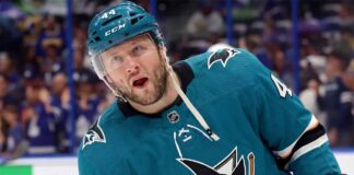 A photo-edit showing NHL defenseman Morgan Rielly wearing a teal San Jose Sharks alternate captain's jersey, number 44. speculative trade scenario image.