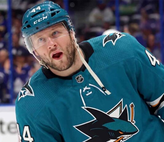 A photo-edit showing NHL defenseman Morgan Rielly wearing a teal San Jose Sharks alternate captain's jersey, number 44. speculative trade scenario image.