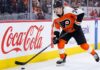 A photo of Philadelphia Flyers forward Owen Tippett (74) in action, skating and controlling the puck on the ice during an NHL game, used to analyze his performance and trade status.