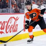 A photo of Philadelphia Flyers forward Owen Tippett (74) in action, skating and controlling the puck on the ice during an NHL game, used to analyze his performance and trade status.