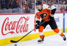 A photo of Philadelphia Flyers forward Owen Tippett (74) in action, skating and controlling the puck on the ice during an NHL game, used to analyze his performance and trade status.