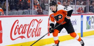 A photo of Philadelphia Flyers forward Owen Tippett (74) in action, skating and controlling the puck on the ice during an NHL game, used to analyze his performance and trade status.