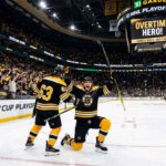 David Pastrnak of the Boston Bruins celebrates scoring the overtime game-winning goal against the Buffalo Sabres during Game 5 of the NHL Stanley Cup Playoffs.