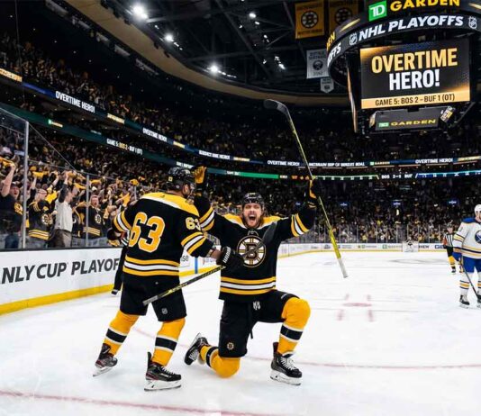 David Pastrnak of the Boston Bruins celebrates scoring the overtime game-winning goal against the Buffalo Sabres during Game 5 of the NHL Stanley Cup Playoffs.