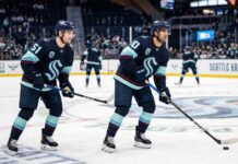 Seattle Kraken young stars Shane Wright (51) and Matty Beniers (10) in action at Climate Pledge Arena, highlighting the team’s current offensive talent as they navigate trade rumors and roster improvements.