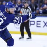 Breakout NHL defenseman Darren Raddysh taking a shot during a game for the Tampa Bay Lightning. Raddysh is a rumored offseason free agency target for the Toronto Maple Leafs retool.