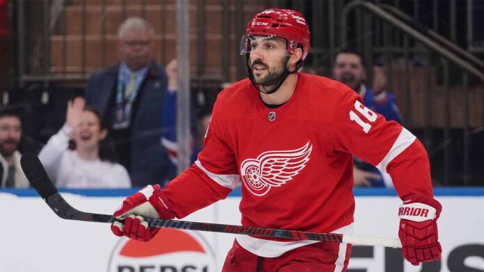 A conceptual image showing New York Rangers center Vincent Trocheck wearing a Detroit Red Wings home jersey #16 on the ice, illustrating NHL trade rumors.