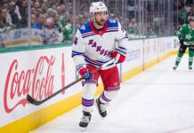 A photograph of New York Rangers forward Vincent Trocheck skating on the ice, fueling trade rumors about his future with the team.