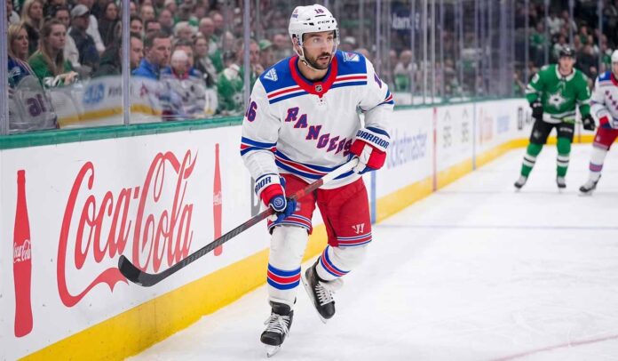 A photograph of New York Rangers forward Vincent Trocheck skating on the ice, fueling trade rumors about his future with the team.