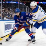 Mika Zibanejad and Tage Thompson battle for the puck at Madison Square Garden during the New York Rangers vs. Buffalo Sabres NHL game on April 8, 2026.