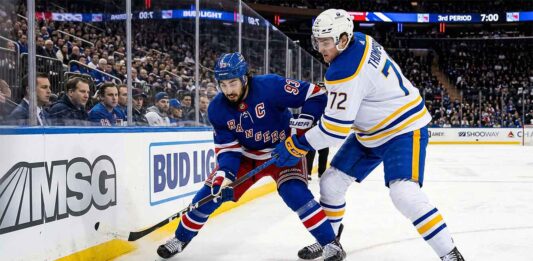 Mika Zibanejad and Tage Thompson battle for the puck at Madison Square Garden during the New York Rangers vs. Buffalo Sabres NHL game on April 8, 2026.