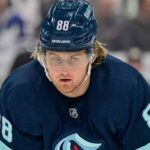 A visualization of Toronto Maple Leafs star William Nylander wearing a Seattle Kraken jersey and helmet (number 88) amidst blockbuster NHL trade rumors.