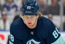 A visualization of Toronto Maple Leafs star William Nylander wearing a Seattle Kraken jersey and helmet (number 88) amidst blockbuster NHL trade rumors.