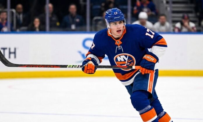 Simon-nemec-rumors-new-York-islanders A photorealistic depiction of New Jersey Devils defenseman Šimon Nemec wearing a New York Islanders home uniform, illustrating trade rumors linking the player to the Islanders.
