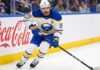 Alex Tuch Contract Rumors: Buffalo Sabres Salary Cap Impact Buffalo Sabres forward Alex Tuch #89 in action skating with the puck, focal point of contract extension negotiations.