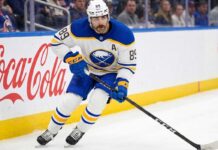 Alex Tuch Contract Rumors: Buffalo Sabres Salary Cap Impact Buffalo Sabres forward Alex Tuch #89 in action skating with the puck, focal point of contract extension negotiations.