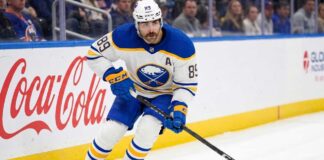 Alex Tuch Contract Rumors: Buffalo Sabres Salary Cap Impact Buffalo Sabres forward Alex Tuch #89 in action skating with the puck, focal point of contract extension negotiations.