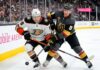 Cutter Gauthier of the Anaheim Ducks and Jack Eichel of the Vegas Golden Knights battle for the puck during Game 1 of their 2026 NHL Playoff series at T-Mobile Arena.