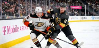 Cutter Gauthier of the Anaheim Ducks and Jack Eichel of the Vegas Golden Knights battle for the puck during Game 1 of their 2026 NHL Playoff series at T-Mobile Arena.