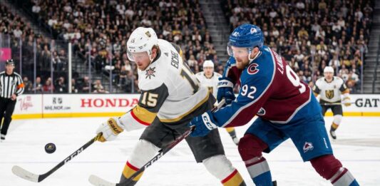 How to Watch Colorado Avalanche vs Vegas Golden Knights Game 3 on TV Today Jack Eichel (Vegas Golden Knights, #15) bats a puck out of the air while battling Gabriel Landeskog (Colorado Avalanche, #92) for possession during an intense sequence in the 2026 NHL Western Conference Final.