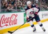 Will Boone Jenner Leave the Columbus Blue Jackets in Free Agency? Columbus Blue Jackets captain Boone Jenner (38) in a white away jersey looking focused on the ice while handling the puck.