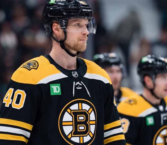 Photo manipulation showing Vancouver Canucks center Elias Pettersson wearing a black Boston Bruins home jersey and helmet, visualizing a potential blockbuster trade scenario.