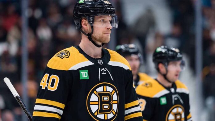 boston-bruins-vancouver-canucks-elias-pettersson-trade Photo manipulation showing Vancouver Canucks center Elias Pettersson wearing a black Boston Bruins home jersey and helmet, visualizing a potential blockbuster trade scenario.