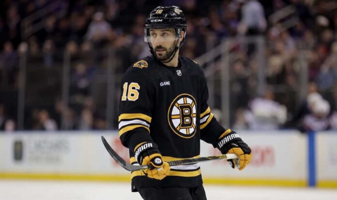 Conceptual photo of New York Rangers center Vincent Trocheck wearing a black Boston Bruins home jersey, number 16, holding a hockey stick on the ice.