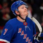 A photo mockup of Ottawa Senators captain Brady Tkachuk wearing a blue New York Rangers number 7 jersey, illustrating the recent NHL blockbuster trade rumors.