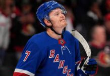 A photo mockup of Ottawa Senators captain Brady Tkachuk wearing a blue New York Rangers number 7 jersey, illustrating the recent NHL blockbuster trade rumors.