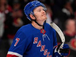 A photo mockup of Ottawa Senators captain Brady Tkachuk wearing a blue New York Rangers number 7 jersey, illustrating the recent NHL blockbuster trade rumors.