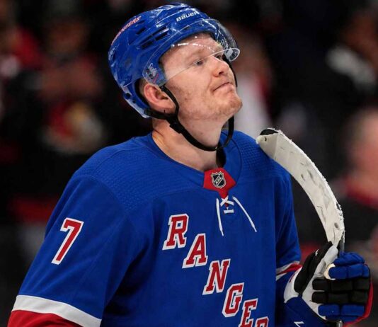 A photo mockup of Ottawa Senators captain Brady Tkachuk wearing a blue New York Rangers number 7 jersey, illustrating the recent NHL blockbuster trade rumors.