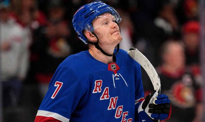 A photo mockup of Ottawa Senators captain Brady Tkachuk wearing a blue New York Rangers number 7 jersey, illustrating the recent NHL blockbuster trade rumors.