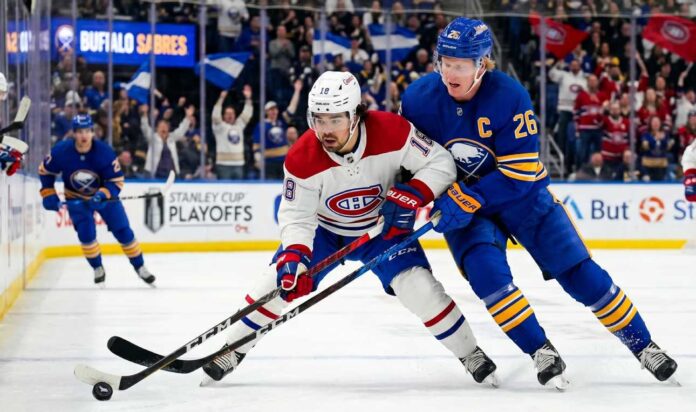 buffalo-sabres-montreal-canadiens-game-7-highlights Montreal Canadiens Alex Newhook (18) and Buffalo Sabres Rasmus Dahlin (26) battle for a puck in Game 7.