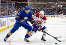 What Channel is the Montreal Canadiens vs Buffalo Sabres Game 7 On? Tage Thompson #72 of the Buffalo Sabres and Nick Suzuki #14 of the Montreal Canadiens intensely battle for the puck on the ice during an NHL playoff game.