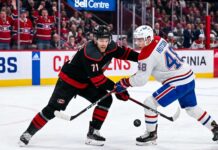 How to Watch Carolina Hurricanes vs Montreal Canadiens Game 3 (TV & Stream) NHL hockey game faceoff at Bell Centre: Carolina Hurricanes forward Taylor Hall #71 and Montreal Canadiens defenseman Lane Hutson #48 prepare for puck drop during the NHL playoffs.