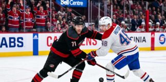 How to Watch Carolina Hurricanes vs Montreal Canadiens Game 3 (TV & Stream) NHL hockey game faceoff at Bell Centre: Carolina Hurricanes forward Taylor Hall #71 and Montreal Canadiens defenseman Lane Hutson #48 prepare for puck drop during the NHL playoffs.