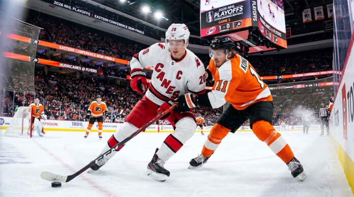 Sebastian Aho (Carolina Hurricanes, #20) controls the puck against Travis Konecny (Philadelphia Flyers, #11) during Game 3 of the 2026 NHL Eastern Conference Semi-Finals at Xfinity Mobile Arena.