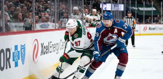 How to Watch Avalanche vs. Wild Game 4: TV Channel & Stream Minnesota Wild star Kirill Kaprizov (#97) engages in an intense board battle for the puck with Colorado Avalanche captain Nathan MacKinnon (#29) during Game 4 of their NHL playoff series at Xcel Energy Center on Monday, May 11, 2026.