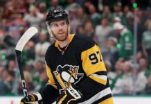 Edmonton Oilers captain Connor McDavid looking focused on the ice amidst intense Pittsburgh Penguins trade rumors.
